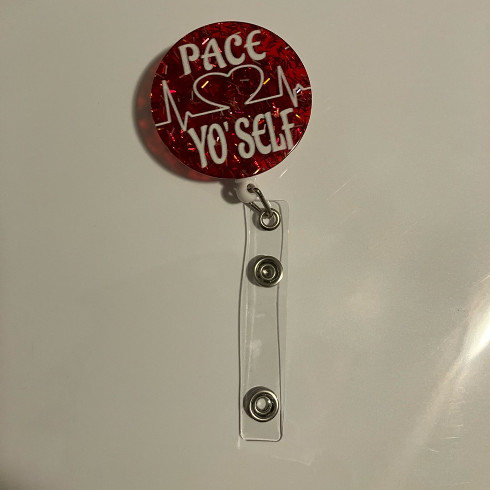 Red Badge Reel with Heart Design
